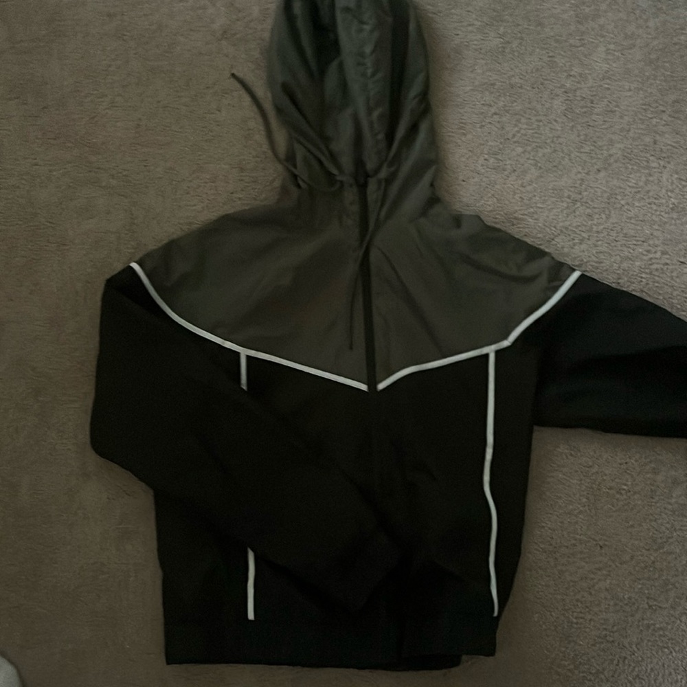 light weight green wind breaker size medium